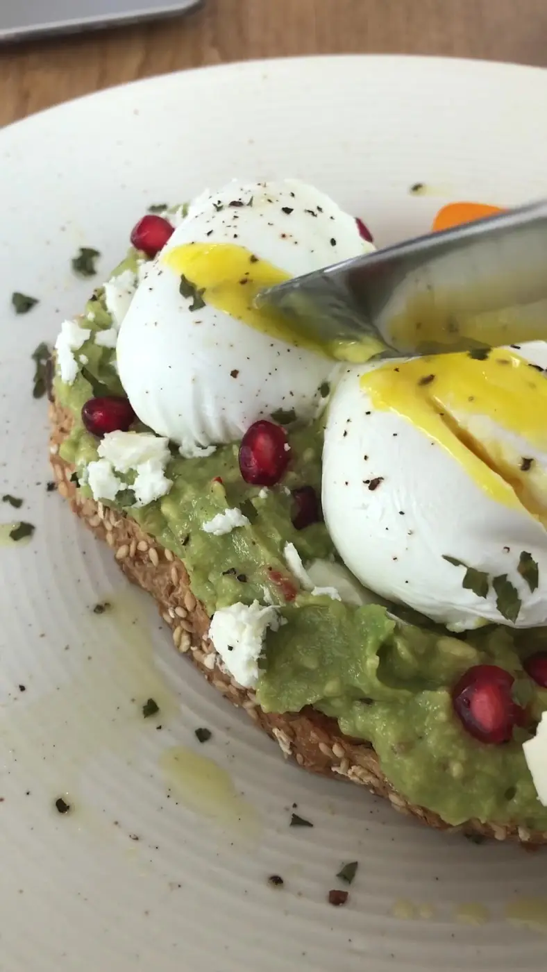 Poached egg on avocado toast at Autograph Deli