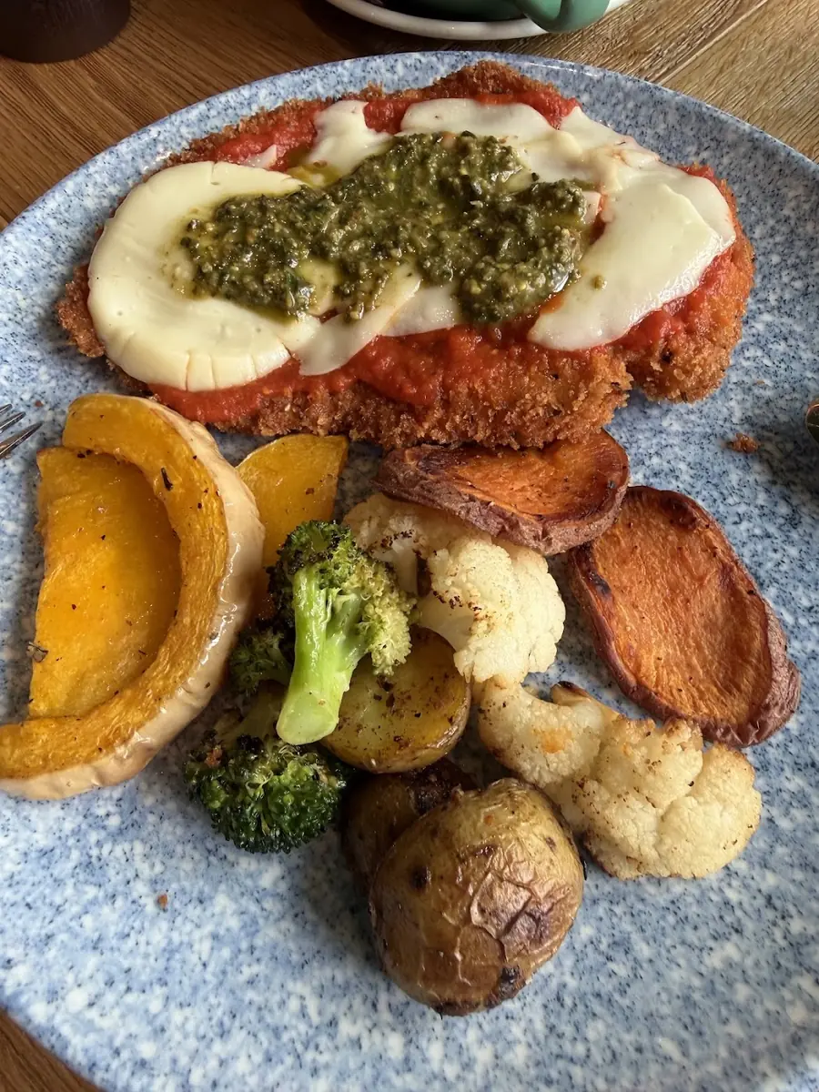 Chicken parmigiana with greens at Autograph Deli